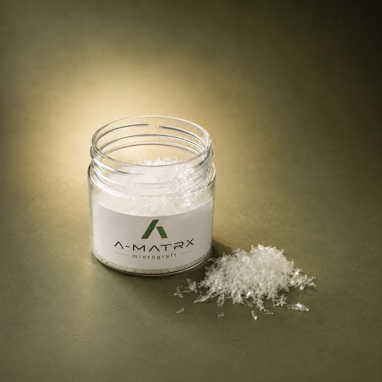 A-MATRX Micrograft jar with precision-cut tissue beside it