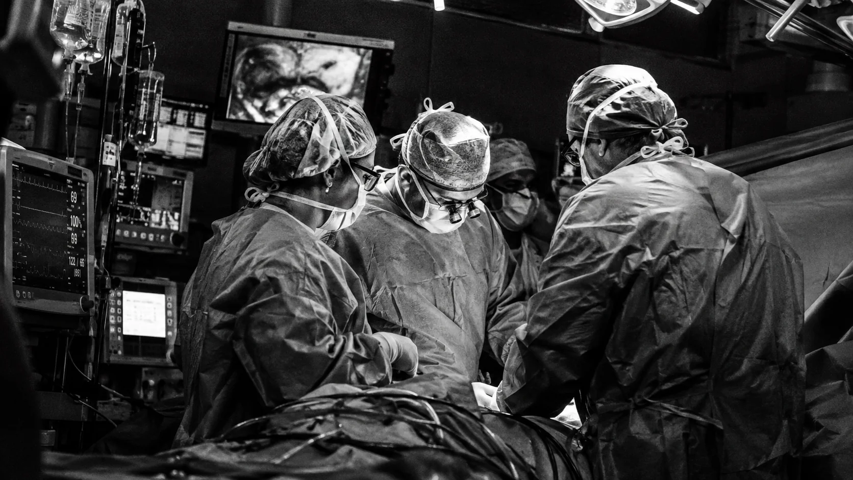 Colorectal surgical team working together in an operating room